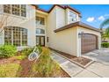 House exterior view, highlighting the entryway and garage at 18801 Chaville Rd, Lutz, FL 33558