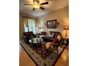 Living room with hardwood floors, large windows, and comfortable seating at 1910 E Palm Ave # 10303, Tampa, FL 33605
