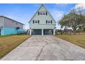 A-frame home with carport, and spacious yard at 3363 Poinsettia Dr, Hernando Beach, FL 34607