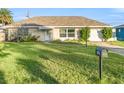 House exterior showcasing a well-maintained lawn and classic design at 9167 108Th St, Seminole, FL 33772