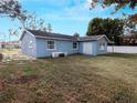 Large backyard with grassy area and a partially visible fence at 1817 Oregon Ne Ave, St Petersburg, FL 33703