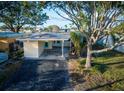 Exterior view of the front of the house and driveway at 348 Bahia Vista Dr, Indian Rocks Beach, FL 33785