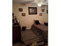 Bedroom with animal print bedding, ceiling fan, and framed artwork at 4150 15Th S Ave, St Petersburg, FL 33711