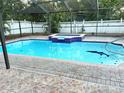 Rectangular swimming pool with a built-in spa at 4714 W Bay Vista Ave, Tampa, FL 33611