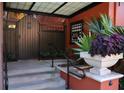 Building entryway with steps, gate, and lush landscaping at 504 S Armenia Ave # 1323, Tampa, FL 33609