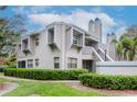 Condo complex exterior view, showcasing a well-maintained building and landscaping at 8737 Bardmoor Pl # 101, Seminole, FL 33777