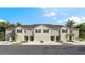 Stylish townhomes with garages, landscaping, and palm trees at 1148 Great Ibis Dr, Ruskin, FL 33570