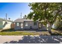 Newly renovated duplex, featuring gray exterior and landscaping at 255 146Th Ave E, Madeira Beach, FL 33708