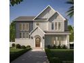 Two-story house with gray and white exterior, arched entryway, and landscaped yard at 3220 W Villa Rosa St, Tampa, FL 33611