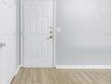 Front door entry with wood-look flooring at 501 Knights Run Ave # 2308, Tampa, FL 33602
