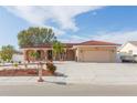 One-story home with attached garage and a red tile roof on a corner lot at 6512 Manila Palm Way, Apollo Beach, FL 33572