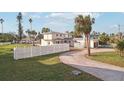 House exterior view, showcasing landscaping and a circular driveway at 15825 Redington Dr, Redington Beach, FL 33708