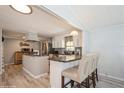 Modern kitchen with granite countertops and light cabinets at 233 Tarpon Ln, Oldsmar, FL 34677
