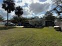 Single-story home with a spacious backyard at 10002 Memorial Hwy, Tampa, FL 33615