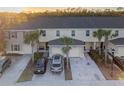 Aerial view of townhomes showing a well-maintained exterior, landscaping, and ample parking at 12827 Buffalo Run Dr, Gibsonton, FL 33534