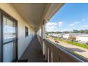 Building hallway with access to condo units and an outside view at 19029 Us Highway 19 N # 8-25, Clearwater, FL 33764