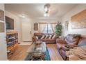 Spacious living room with brown leather couches and wood floors at 2432 Lake Woodberry Cir # 2432, Brandon, FL 33510