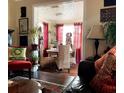 Inviting living room featuring hardwood floors, stylish decor, and plenty of natural light at 3246 Prescott N St, St Petersburg, FL 33713