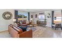 Living room featuring a large TV and comfortable seating at 5253 Salt Marsh Rd, Wimauma, FL 33598