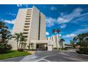 Condo building exterior showcasing architectural details and landscaping at 5940 Pelican Bay S Plz # 1106, Gulfport, FL 33707