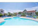 Community pool with plenty of lounge chairs at 6059 Bahia Del Mar Blvd # 233, St Petersburg, FL 33715