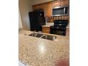 Kitchen with granite countertops and stainless steel appliances at 1000 W Horatio St # 108, Tampa, FL 33606