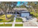 Single story home with a large yard and driveway at 1040 31St E St, Palmetto, FL 34221