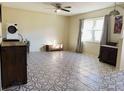 Living room featuring tile flooring and a charming vintage aesthetic at 37210 Bermont Rd, Punta Gorda, FL 33982