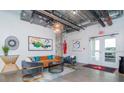 Stylish condo lobby with modern furniture and exposed ductwork at 101 N 12Th St # 207, Tampa, FL 33602