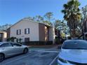 Building exterior with parking and landscaping at 21038 Voyager Blvd # 4, Land O Lakes, FL 34638