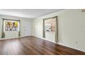Living room with wood floors and neutral walls at 224 Sky Loch E Dr, Dunedin, FL 34698
