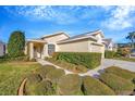 Attractive single-story home with lush landscaping at 2852 Banyan Hill Ln, Land O Lakes, FL 34639