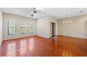 Bright dining area with hardwood floors and access to a patio at 30129 Mossbank Dr, Wesley Chapel, FL 33543