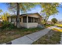 1-story home with a porch and landscaping at 4734 15Th S Ave, St Petersburg, FL 33711