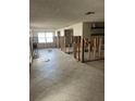 Renovation in progress, kitchen area with tiled floors and exposed framing at 6114 Seabreeze Dr, Port Richey, FL 34668