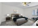 Modern bedroom featuring a stylish bed, contemporary art, and a ceiling fan at 3714 Greenery Ct # 214, Tampa, FL 33618