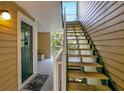 Condo building entryway with green door and stairs at 10110 Winsford Oak Blvd # 612, Tampa, FL 33624
