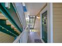 Condo hallway with green door and stairs at 10110 Winsford Oak Blvd # 612, Tampa, FL 33624