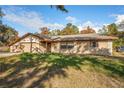 House exterior showcasing a ranch style home with stone accents at 1130 Barranca Ave, Spring Hill, FL 34609