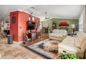 Spacious living room with hardwood floors and comfy furniture at 1130 Barranca Ave, Spring Hill, FL 34609