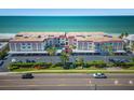 Aerial of condo complex with parking and ocean view at 2900 Gulf Blvd # 212, Belleair Beach, FL 33786