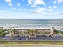 Oceanfront condo building with parking and beach access at 3400 Gulf Blvd # 105, Belleair Beach, FL 33786