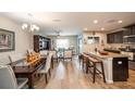 Open kitchen with island, granite counters, and stainless steel appliances at 5025 Cactus Needle Ln, Wesley Chapel, FL 33544