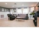 Spacious living room with a fireplace and comfortable seating at 7838 Avenal Loop, New Port Richey, FL 34655