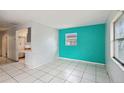 Living room with teal accent wall and tiled floor at 2901 Dr Martin Luther King Jr S St, St Petersburg, FL 33705