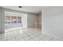 Living room with tiled floor and large window at 2901 Dr Martin Luther King Jr S St, St Petersburg, FL 33705