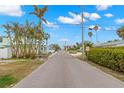 Residential street lined with lush greenery and homes at 204 163Rd Ave, Redington Beach, FL 33708