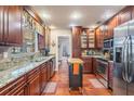 Spacious kitchen with granite countertops and stainless steel appliances at 4307 Gainsborough Ct, Tampa, FL 33624