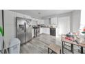 Kitchen with stainless steel appliances and white cabinets at 5117 12Th S Ave, Gulfport, FL 33707