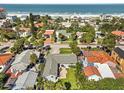 An aerial view of a beach neighborhood with homes near the sandy shore at 709 Mandalay Ave, Clearwater Beach, FL 33767